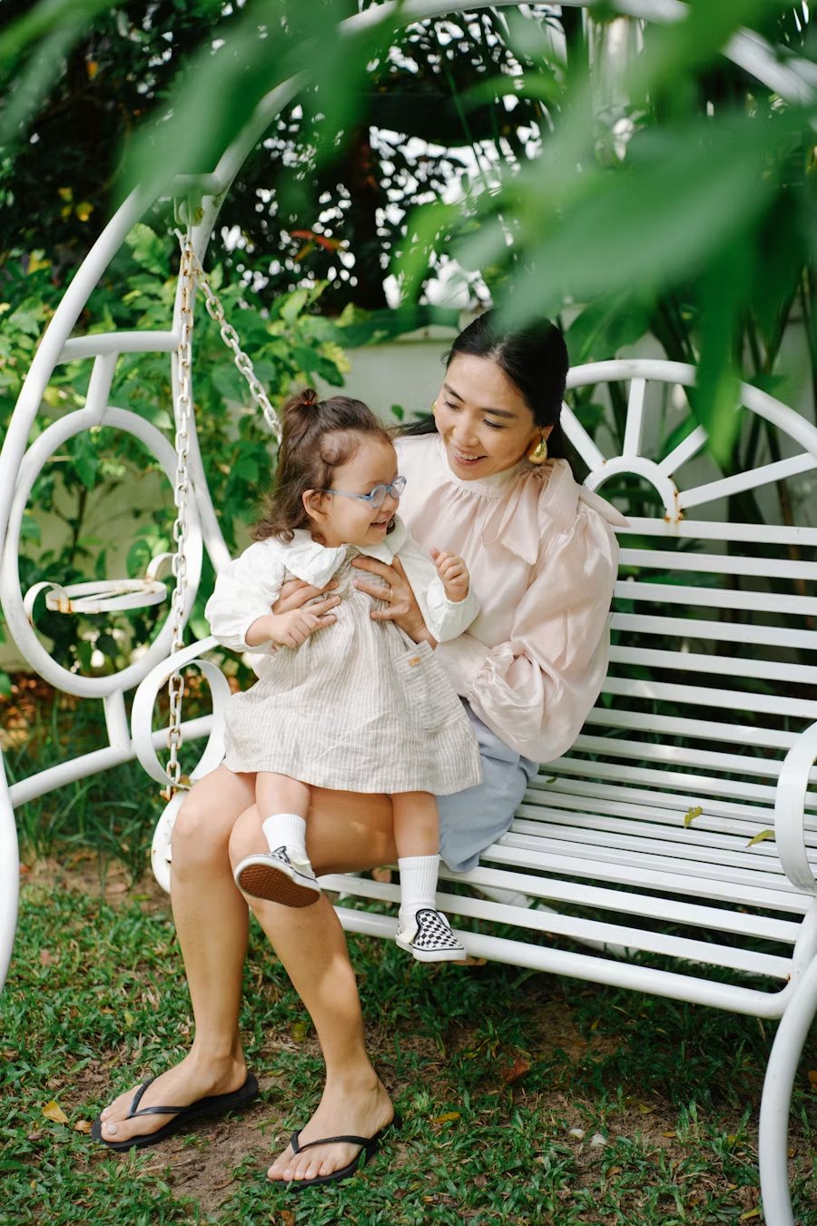 Mom and babysitter sitting together going over a checklist