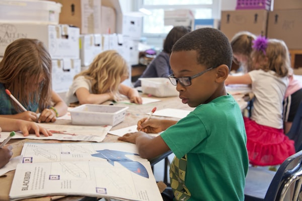Mom and child looking at school backpack and supplies together